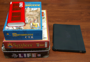 Game Boxes Next to an iPad